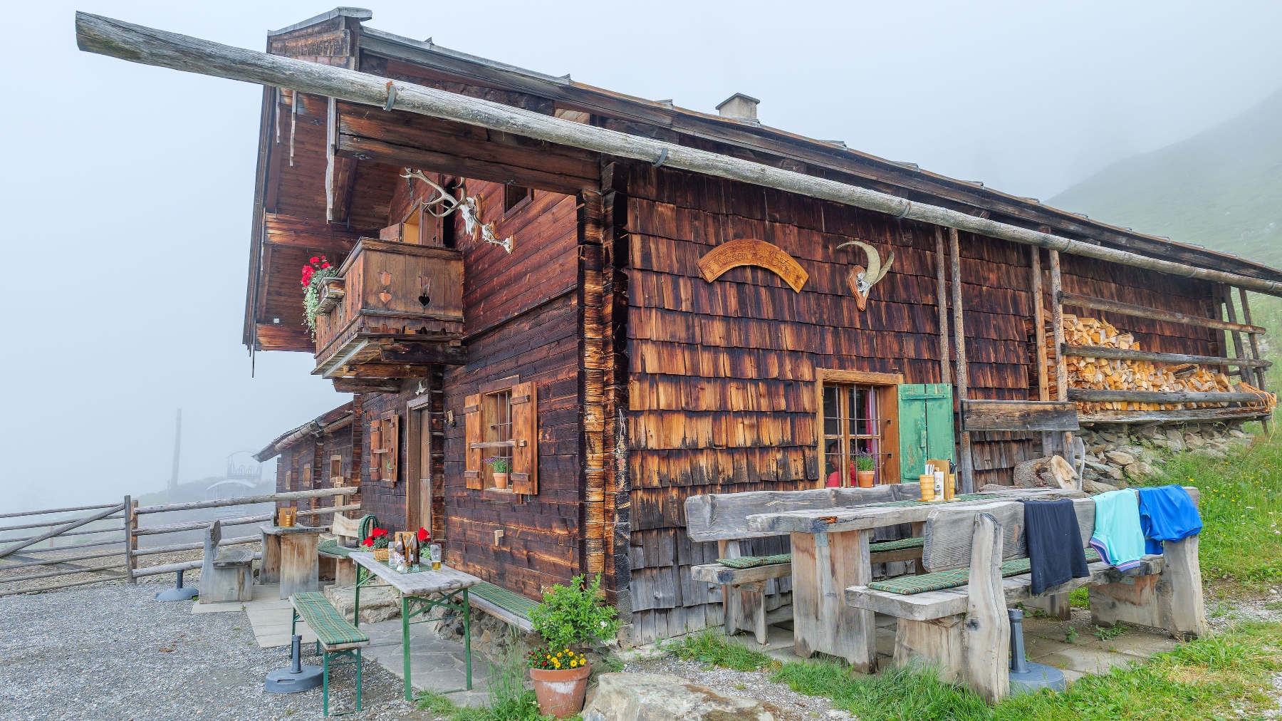 Wooden hut at Katzsteinalm with outdoor seating